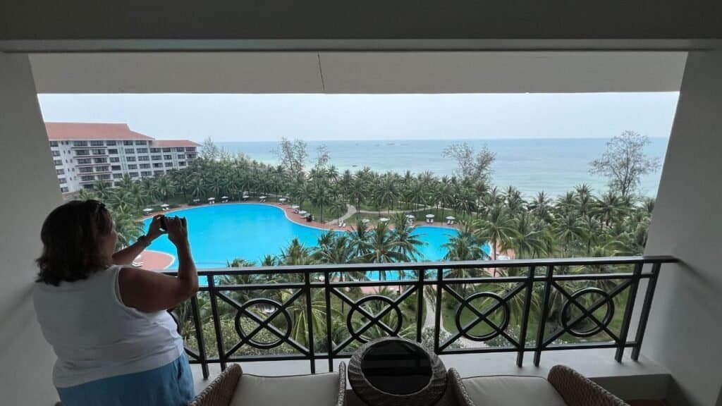 the balcony view over the pool and ocean during a bargain stay in Vietnam