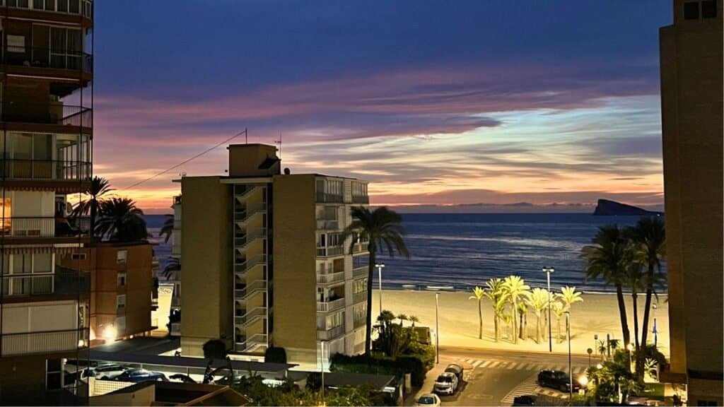 sunrise on benidorm beach from an apartment
