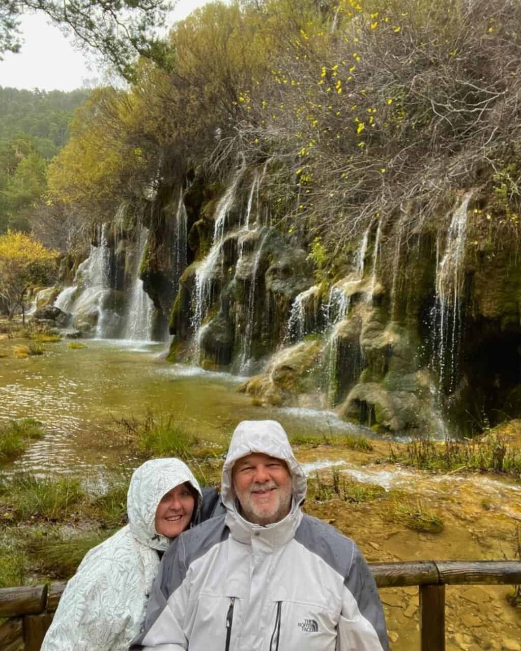 couple in front of the beautiful rio cuervo waterfalls