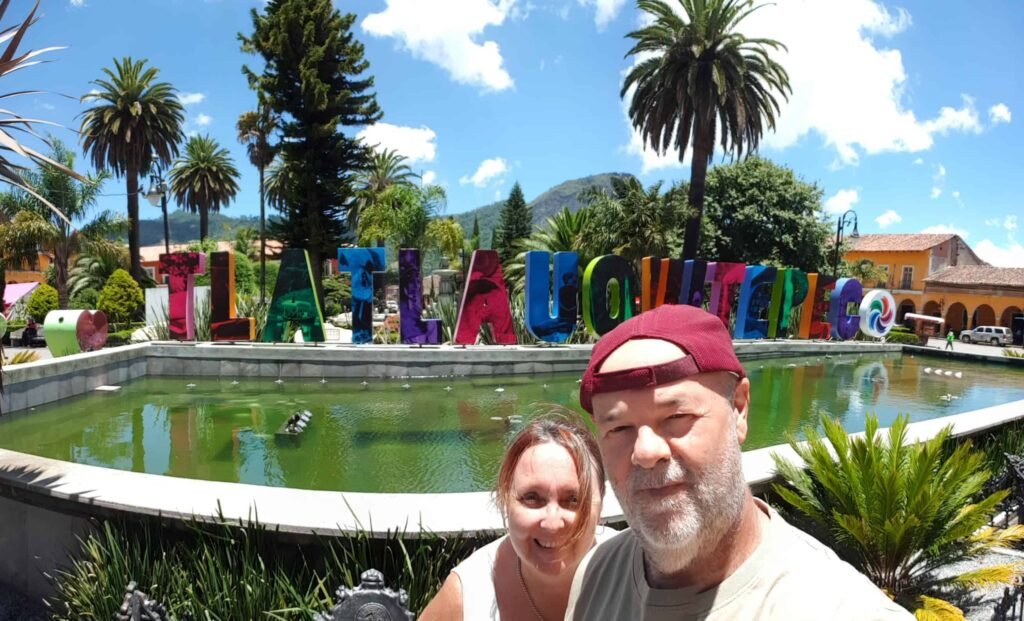 selfie couple in front of the Tlatlauquitepec sign